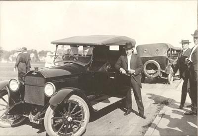 In this photo taken around 1915, Richardson sits in his automobile outside the Administration Building.