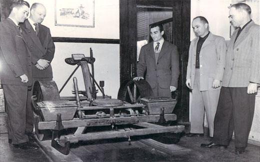 President Bob Foster views antique farming equipment once used on campus at the Northwest Farm.